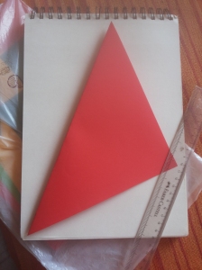 Fold once to form a large triangle