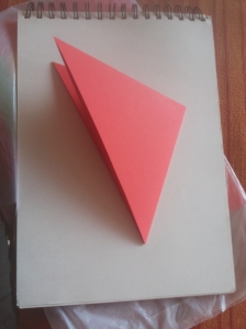 Fold again to form a small triangle